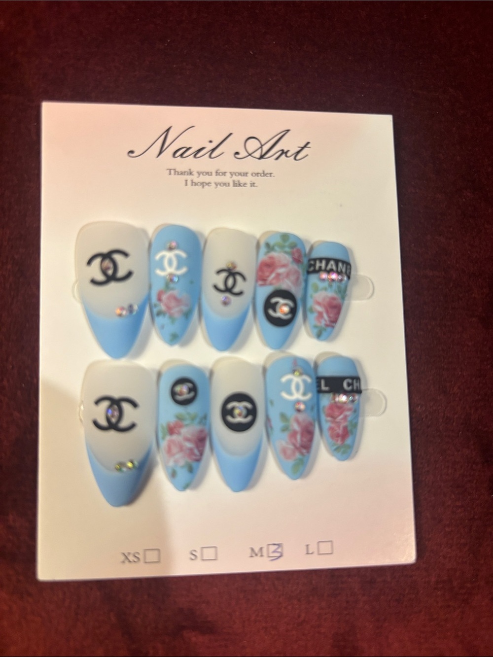 Designer-Inspired Blue Floral Nail Set with Logo Accent